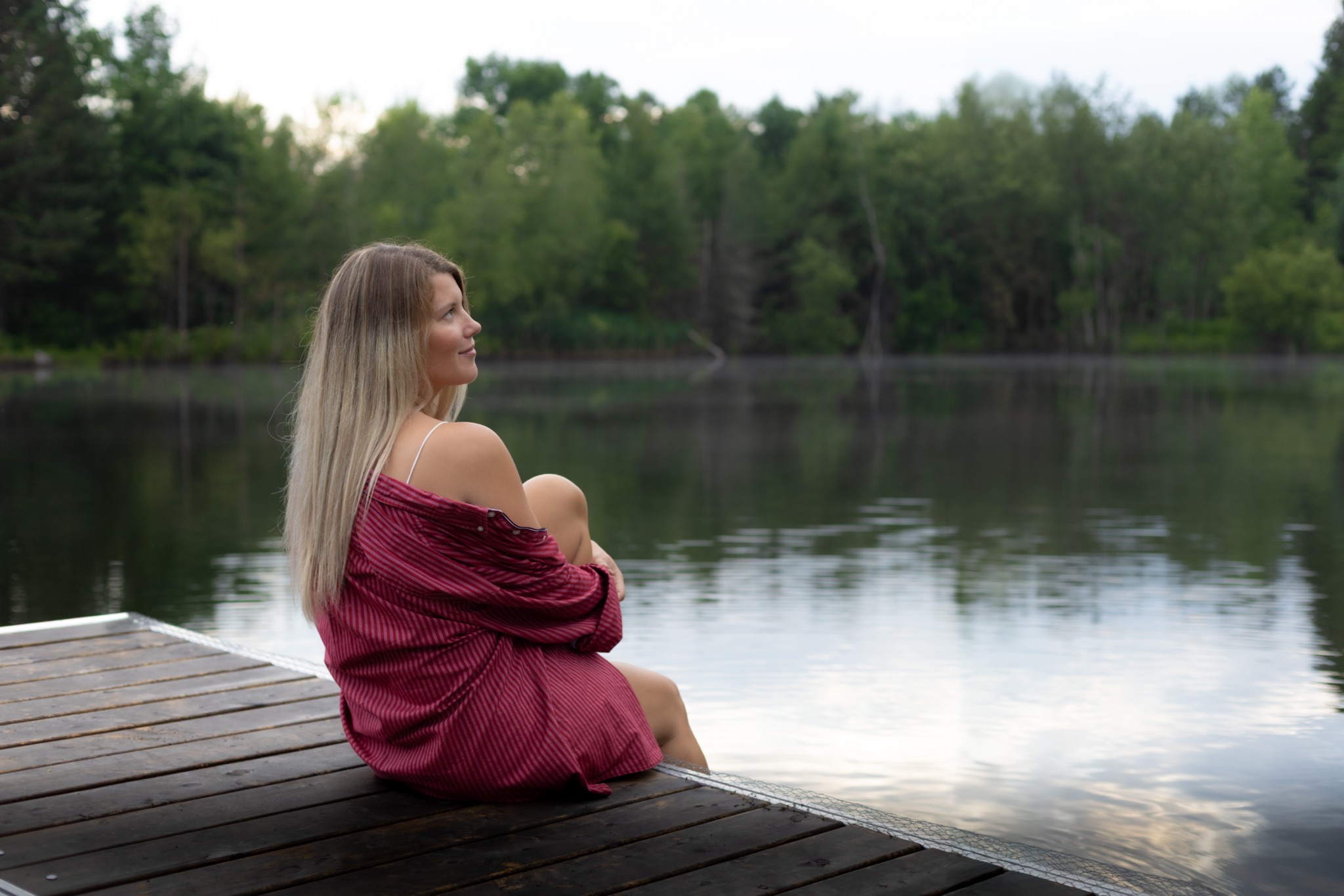 A woman breathing freely, face turned up to the sky